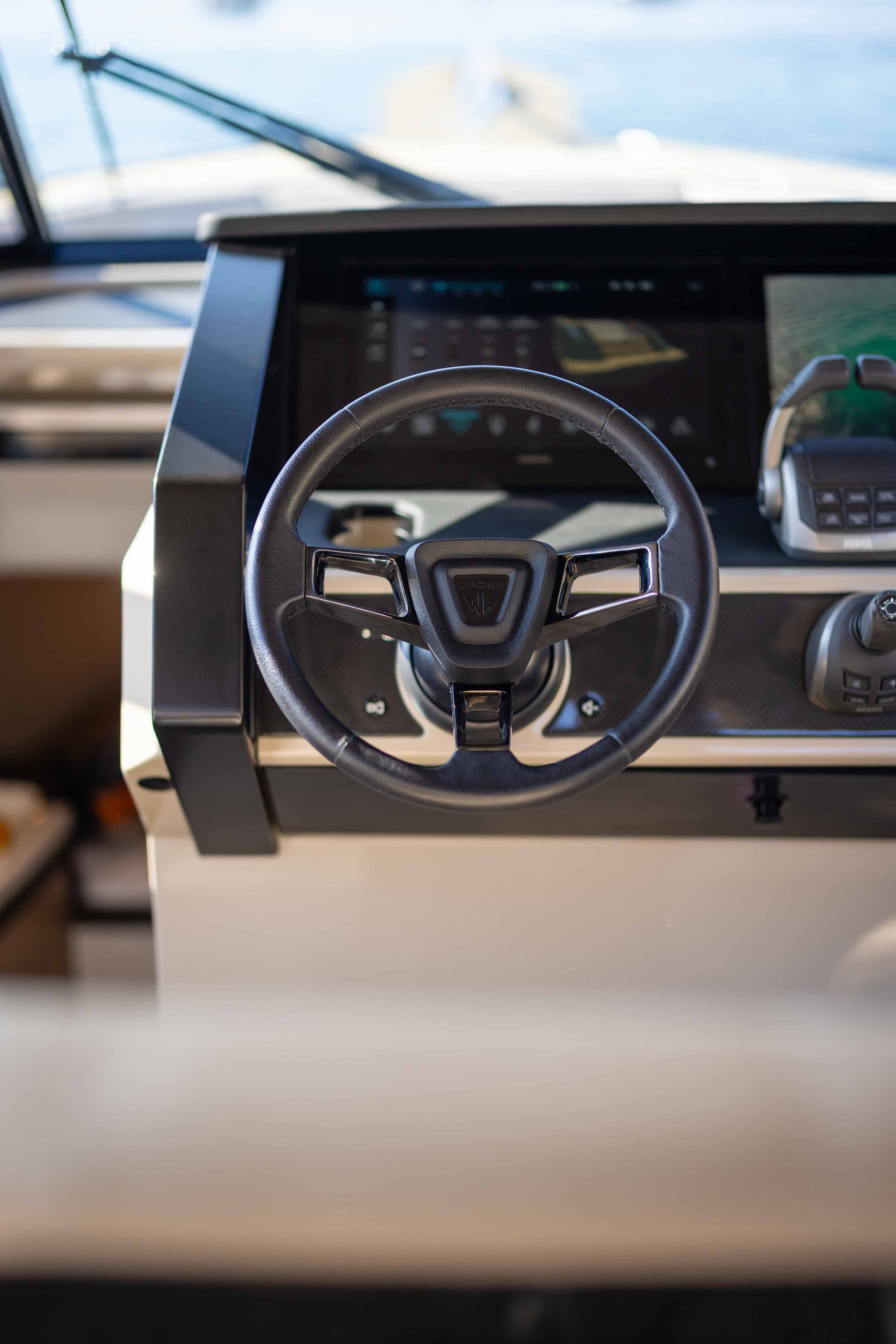 wajer 44 s cockpit dashboard steering wheel joystisck screens frontal.jpg