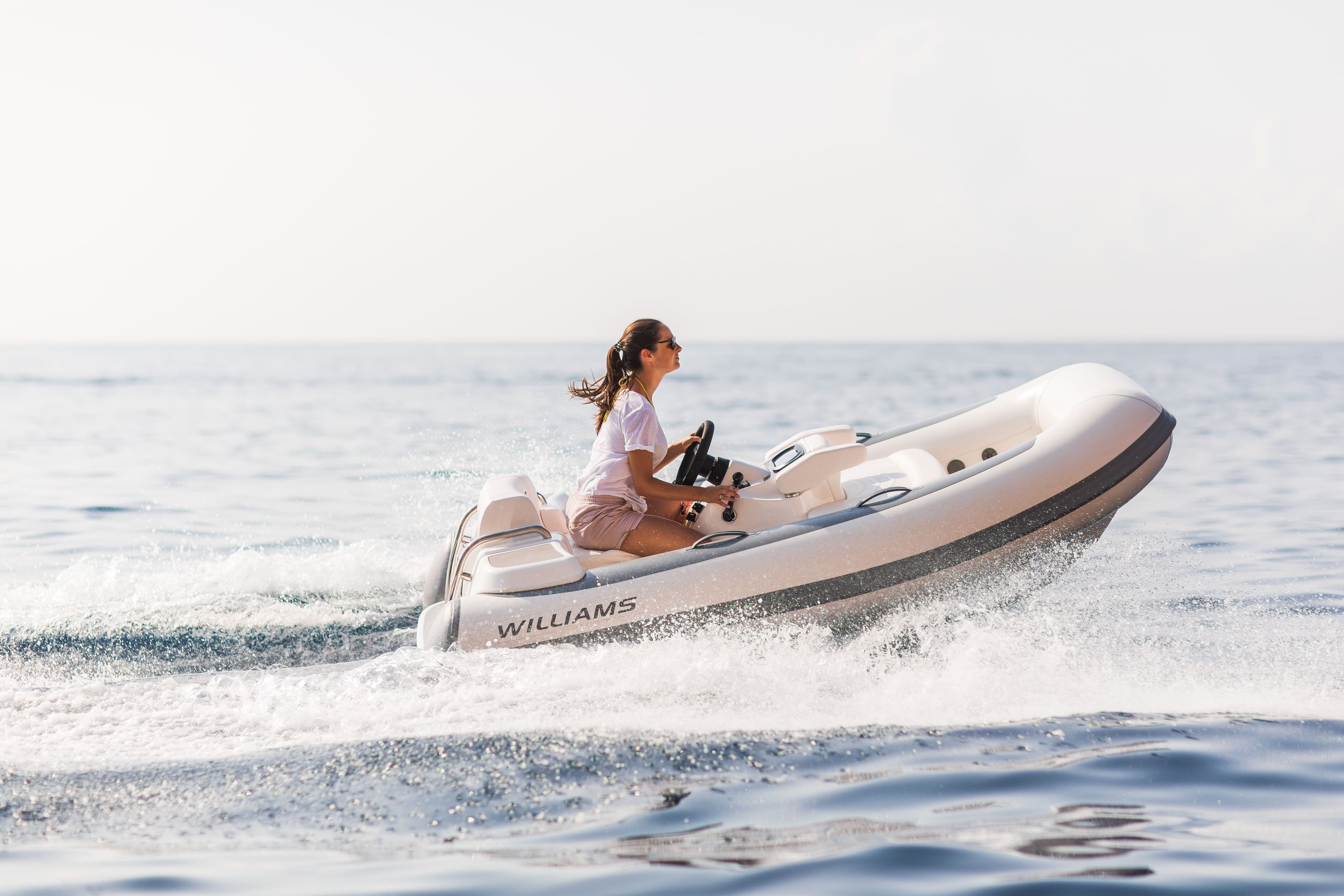 Williams TurboJet Tender 285 sailing right woman girl