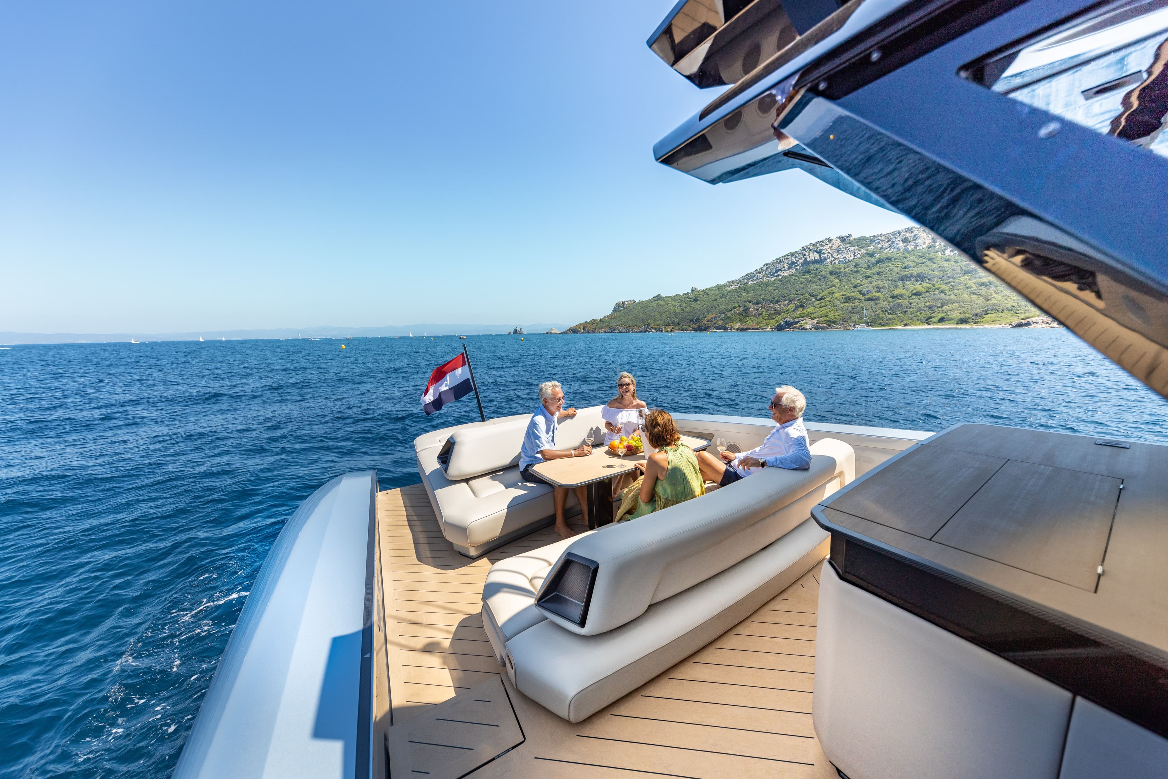 Wajer 77 Picolette aft deck sun lounge table friends